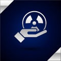 Silver Radioactive in hand icon isolated on dark blue background. Radioactive toxic symbol. Radiation Hazard sign