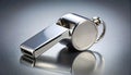 Silver Referee Whistle on a Reflective Surface Royalty Free Stock Photo