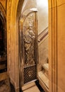 Silver relief door at the entrance to the stairway leading to the shrine of Our Lady of Montserrat. Royalty Free Stock Photo