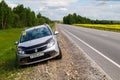 silver renault sandero stepway on verge of interstate road