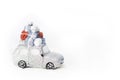 Silver retro toy car delivering Christmas or New Year gifts on white background. Christmas toy. Christmas holiday celebration Royalty Free Stock Photo