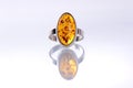 Silver ring with amber stone Royalty Free Stock Photo