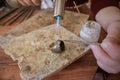 Silver ring being soldered on the work bench. Soldering using gas torch. Royalty Free Stock Photo