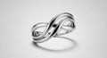 Silver ring featuring an infinity knot design, symbolizing endlessness or unity. The ring Royalty Free Stock Photo