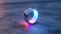 Silver ring glowing reflection blue light orange light metallic jewelry smooth circular modern Royalty Free Stock Photo