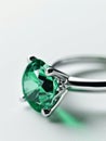 Silver ring with green emerald gemstone. Royalty Free Stock Photo