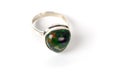 Silver ring with opal stone of green color. Royalty Free Stock Photo