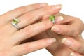 Silver ring with peridot on finger