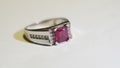 Silver Ring with Red Gemstone on White Background Royalty Free Stock Photo