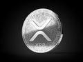 Silver Ripple XRP cryptocurrency physical concept coin isolated on black background. 3D rendering Royalty Free Stock Photo