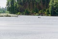 Silver river in the sunlight, people on kayaks in the distance Royalty Free Stock Photo