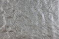 Silver rumpled background with foil texture Royalty Free Stock Photo
