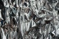 Silver rumpled foil. Gray background with texture Royalty Free Stock Photo