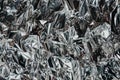 Silver rumpled foil. Gray background with texture Royalty Free Stock Photo