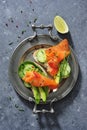 Whole grain bread sandwiches with fresh cucumber, spinach leaves, avocado and smoked salmon