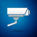 Silver Security camera icon isolated on blue background. Vector Royalty Free Stock Photo