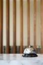 Silver service bell on hotel reception desk. Close up Royalty Free Stock Photo