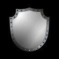 Silver shield shape icon. 3D gray emblem sign isolated on black background. Symbol of security, power, protection. Badge