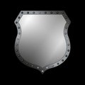 Silver shield shape icon. 3D gray emblem sign isolated on black background. Symbol of security, power, protection. Badge