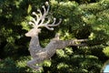 Silver shiny deer hanging on the christmas tree Royalty Free Stock Photo