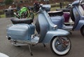 Silver shiny vintage grey motor scooter parked in Rye