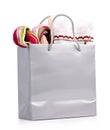 Silver shopping bag with gift on white Royalty Free Stock Photo