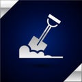 Silver Shovel in the ground icon isolated on dark blue background. Gardening tool. Tool for horticulture, agriculture