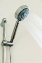 Silver shower head in bathroom with water drops flowing, Bathroom equipment Royalty Free Stock Photo