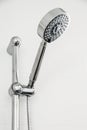 Silver shower head in bathroom with water drops flowing in blue and cool picture style, Bathroom equipment