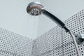 Silver shower head with limescales. Shower damaged from water scale