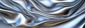 Silver soft satin fabric waves background design. Texture with smooth flowing patterns and light shiny effect