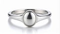 Silver Solitaire Ring with Oval Stone on White Reflective Surface Royalty Free Stock Photo