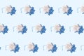 Silver sparkling snowflakes seamles pattern on light blue background