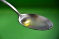 Silver Spoon with Olive Oil 