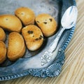 Silver Spoon On Vintage Salver With Cookies