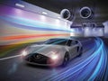 Silver sports car with colorful light trails in tunnel