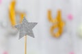 Silver star decoration made with glitter over gray background. Christmas simple composition minimal concept with copy space