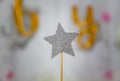 Silver star decoration made with glitter over gray background. Christmas simple composition minimal concept with copy space