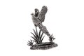 Silver statuette of a soaring bird isolated on white Royalty Free Stock Photo