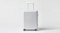 A silver suitcase sitting on top of a white surface Royalty Free Stock Photo