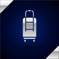 Silver Suitcase for travel icon isolated on dark blue background. Traveling baggage sign. Travel luggage icon. Vector