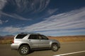 Silver SUV driving in Utah. Royalty Free Stock Photo