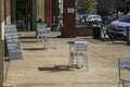 Silver table and chairs in front of the Municipal Market with parked cars in Atlanta Georgia