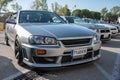 silver tenth generation Nissan Skyline GT R34 at a Japanese car meet