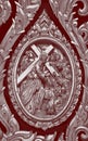 Silver Thai Art classic pattern decorating on red background on the door frame in The Church at Thailand for design and decoration Royalty Free Stock Photo