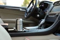 Silver thermos in holder inside of car