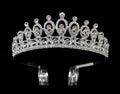 Silver tiara diadem with gems and diamonds isolated on black background