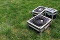 Silver tin box on a green lawn