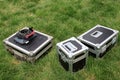 Silver tin box on a green lawn