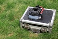 Silver tin box on a green lawn